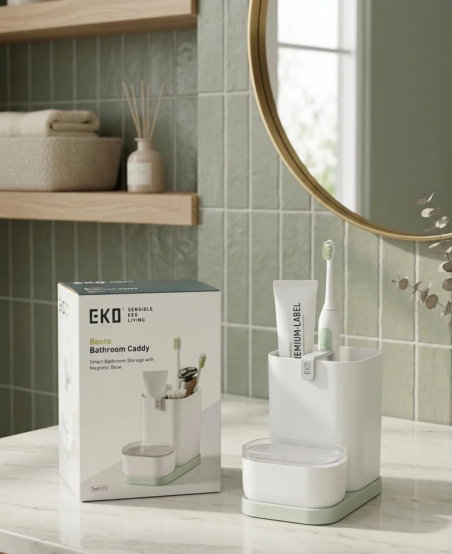 Bathroom caddy with toothbrush, toothpaste, and EKO packaging on a bathroom counter.